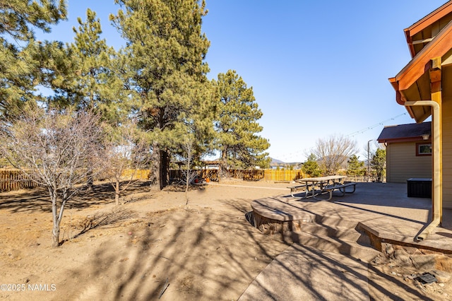 view of yard featuring a patio area and fence