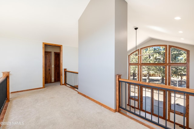 corridor with recessed lighting, baseboards, an upstairs landing, and carpet flooring