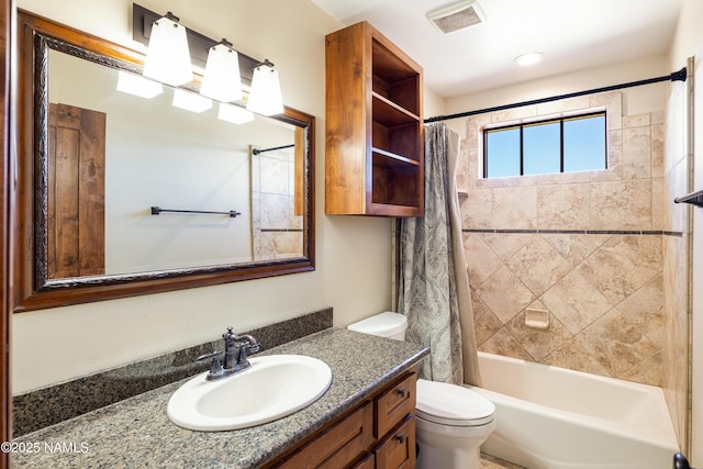 full bath featuring vanity, shower / tub combo, toilet, and visible vents