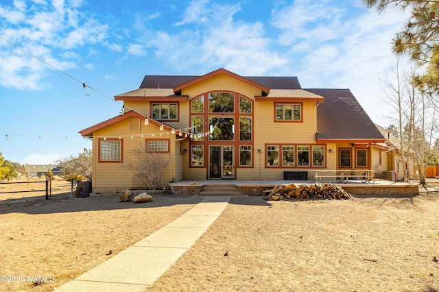 back of house with a patio and fence