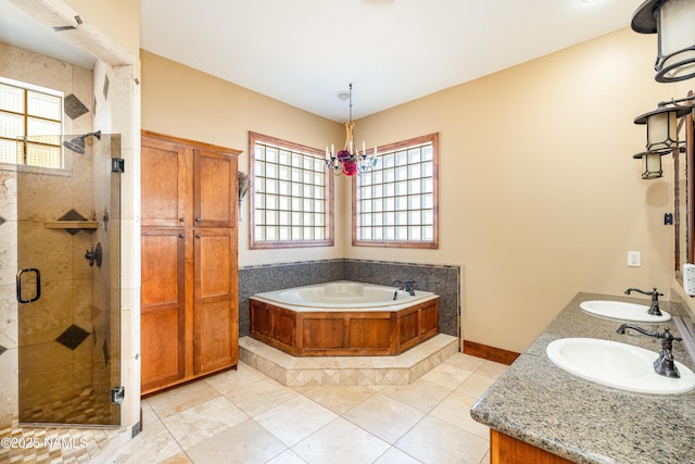 full bathroom featuring a bath, tile patterned floors, a stall shower, and a sink