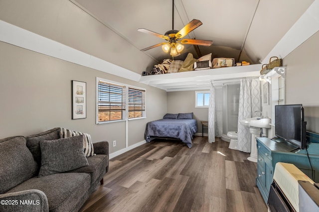 bedroom with heating unit, ceiling fan, vaulted ceiling, wood finished floors, and baseboards