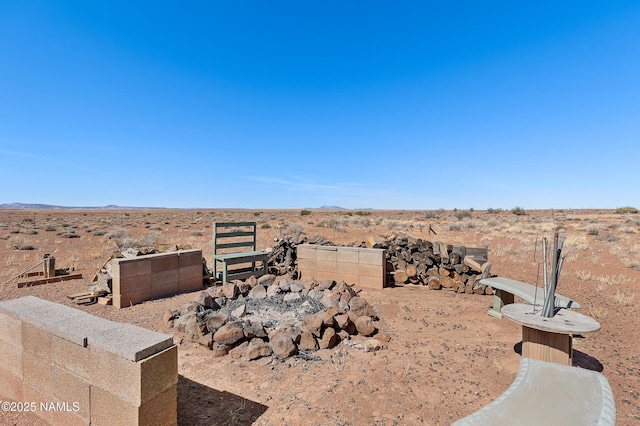 view of yard featuring fence and view of desert