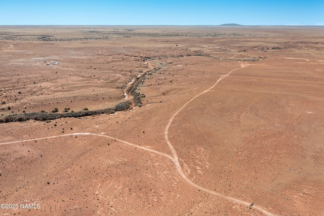 bird's eye view with a mountain view and a desert view