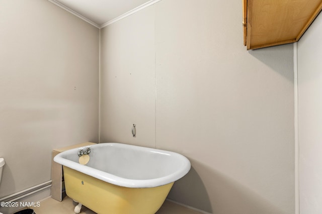 full bathroom featuring ornamental molding and a soaking tub