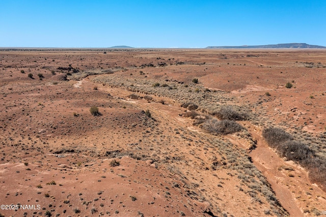 exterior space featuring view of desert and a mountain view