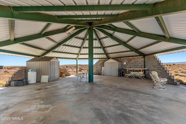 garage with a storage unit and metal wall