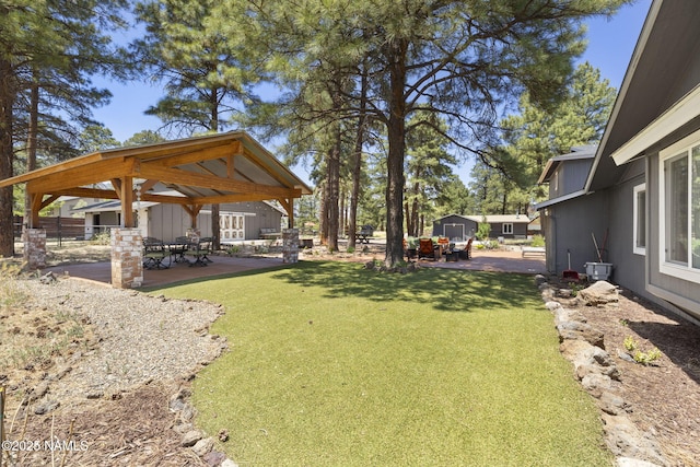 7530 N Rain Valley Rd, Flagstaff, AZ 86004 - view of yard with a gazebo and a patio area