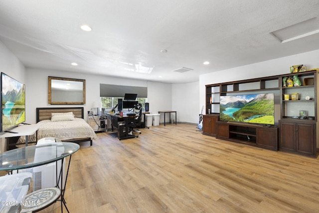 7530 N Rain Valley Rd, Flagstaff, AZ 86004 - bedroom with recessed lighting, light wood finished floors, and attic access