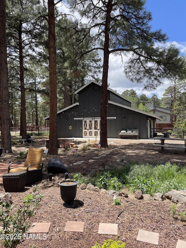 7530 N Rain Valley Rd, Flagstaff, AZ 86004 - view of side of property with board and batten siding