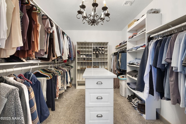 7530 N Rain Valley Rd, Flagstaff, AZ 86004 - spacious closet featuring light colored carpet and a chandelier