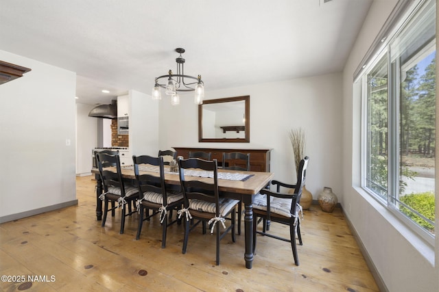7530 N Rain Valley Rd, Flagstaff, AZ 86004 - dining room featuring light wood-style flooring, baseboards, a chandelier, and recessed lighting