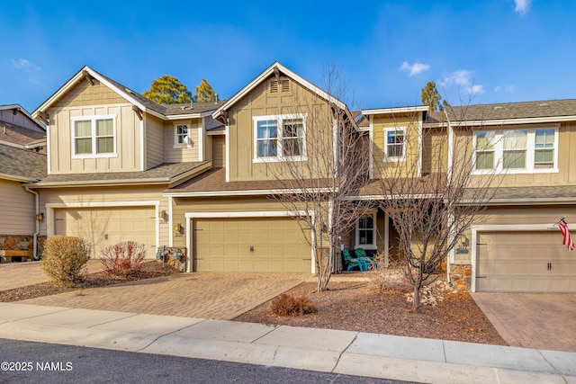 townhome / multi-family property featuring a garage