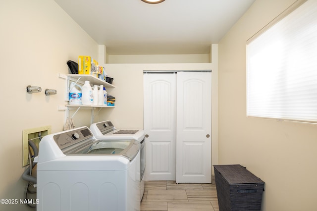 clothes washing area featuring laundry area and independent washer and dryer