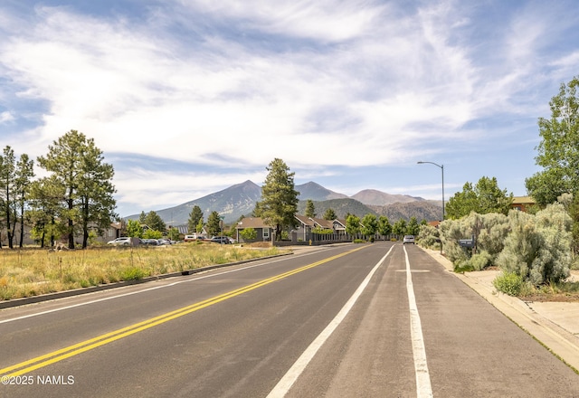 1060 N Pine Cliff Dr, Flagstaff, AZ 86001 - view of asphalt road featuring street lighting, a mountain view, and curbs