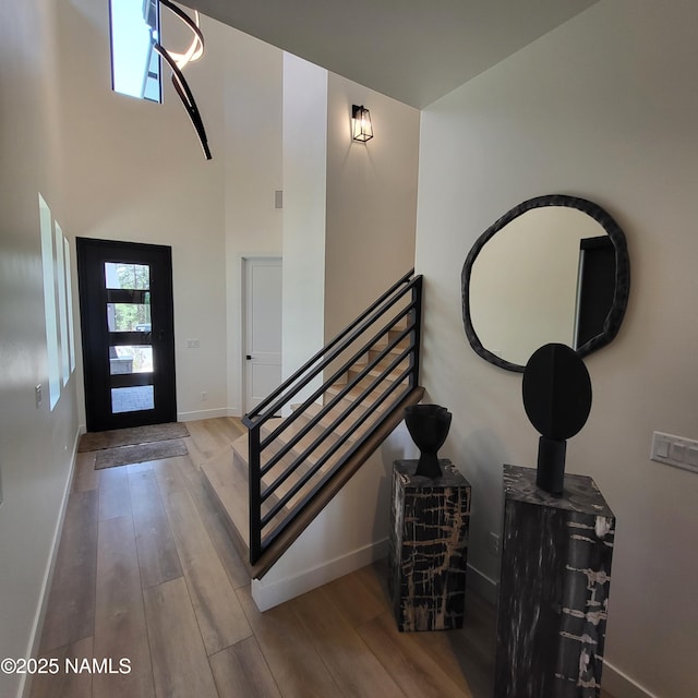 2625 S Cottonrose Ln, Flagstaff, AZ 86005 - foyer entrance featuring wood finished floors, baseboards, and stairs