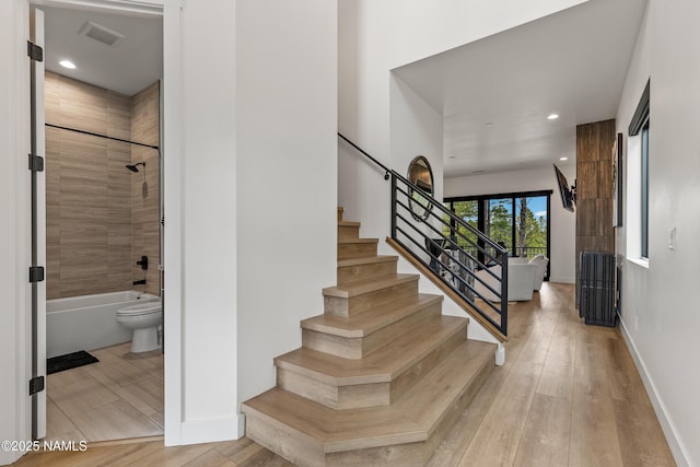 2625 S Cottonrose Ln, Flagstaff, AZ 86005 - stairs featuring wood finished floors, baseboards, and recessed lighting