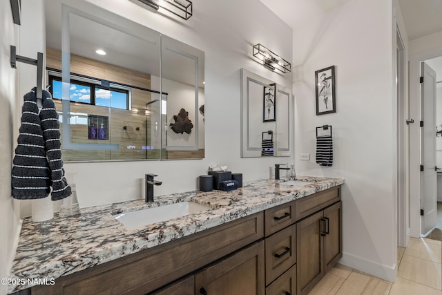 2625 S Cottonrose Ln, Flagstaff, AZ 86005 - bathroom featuring double vanity, a shower stall, baseboards, and tile patterned flooring