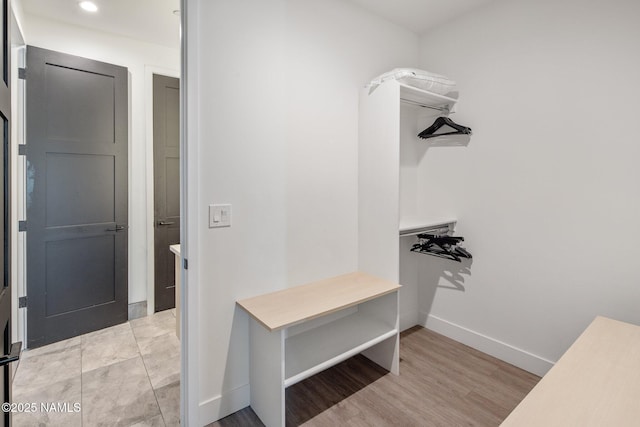 10299 E White Feather Ln, Scottsdale, AZ 85262 - walk in closet featuring light wood-style flooring