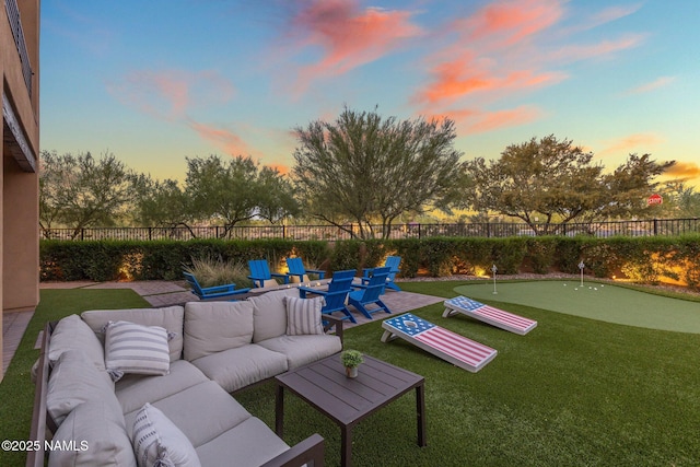 10299 E White Feather Ln, Scottsdale, AZ 85262 - fenced backyard with an area to practice putting, an outdoor living space, and a patio