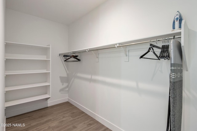 10299 E White Feather Ln, Scottsdale, AZ 85262 - spacious closet featuring wood finished floors