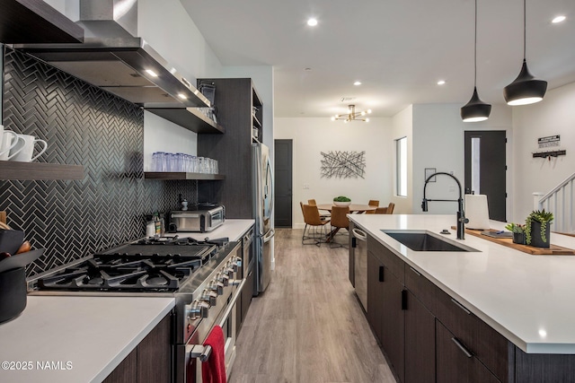 10299 E White Feather Ln, Scottsdale, AZ 85262 - kitchen featuring appliances with stainless steel finishes, range hood, open shelves, light countertops, and recessed lighting