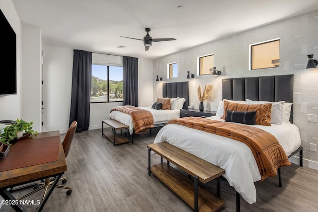 10299 E White Feather Ln, Scottsdale, AZ 85262 - bedroom featuring wood finished floors and ceiling fan