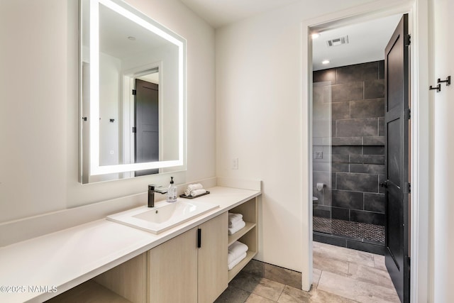 10299 E White Feather Ln, Scottsdale, AZ 85262 - bathroom featuring vanity and tiled shower