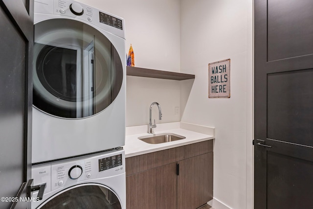 10299 E White Feather Ln, Scottsdale, AZ 85262 - laundry room featuring stacked washer / dryer and cabinet space