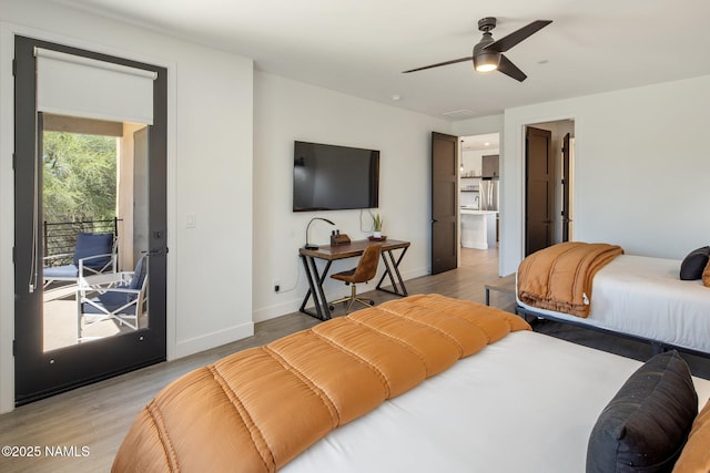 10299 E White Feather Ln, Scottsdale, AZ 85262 - bedroom with access to exterior, light wood finished floors, and a ceiling fan