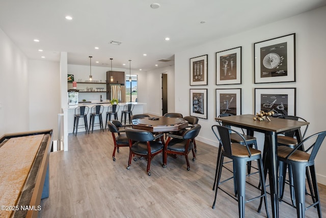 10299 E White Feather Ln, Scottsdale, AZ 85262 - dining area with light wood-type flooring and recessed lighting