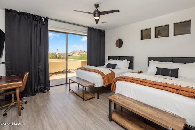 10299 E White Feather Ln, Scottsdale, AZ 85262 - bedroom with access to outside, light wood-style floors, and a ceiling fan