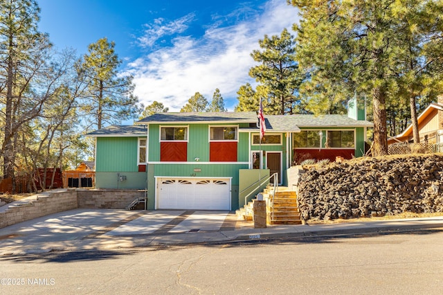 view of front of property featuring a garage