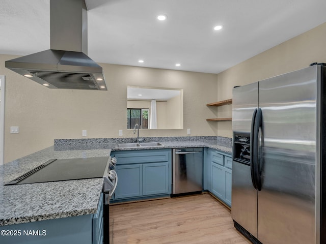 4375 Canyon Loop, Flagstaff, AZ 86005 - kitchen featuring appliances with stainless steel finishes, island exhaust hood, blue cabinetry, light wood-type flooring, and recessed lighting