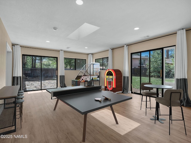 4375 Canyon Loop, Flagstaff, AZ 86005 - game room with light wood-style flooring, plenty of natural light, recessed lighting, and a skylight