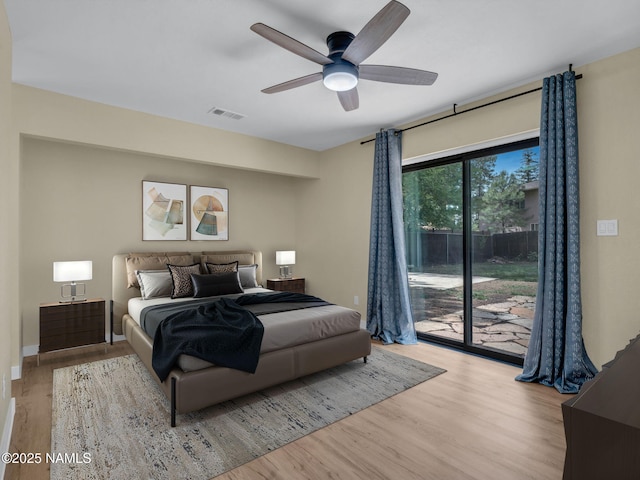 4375 Canyon Loop, Flagstaff, AZ 86005 - bedroom with access to exterior, wood finished floors, and ceiling fan