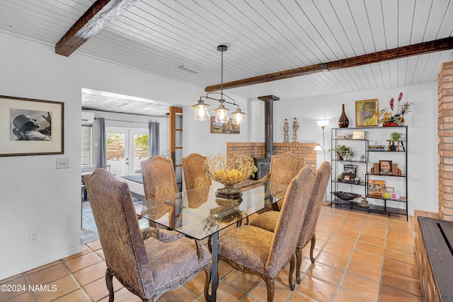 dining area with wood ceiling, french doors, light tile patterned floors, and beamed ceiling