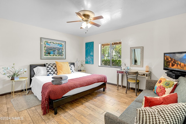 bedroom featuring ceiling fan and light hardwood / wood-style floors