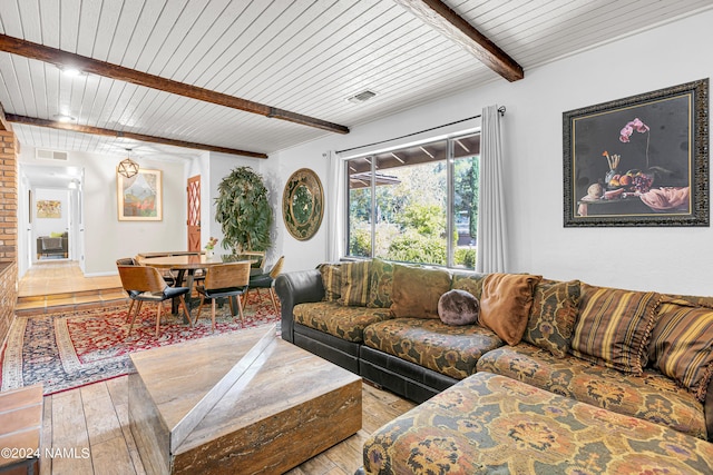 living room featuring wooden ceiling, light wood-type flooring, and beam ceiling