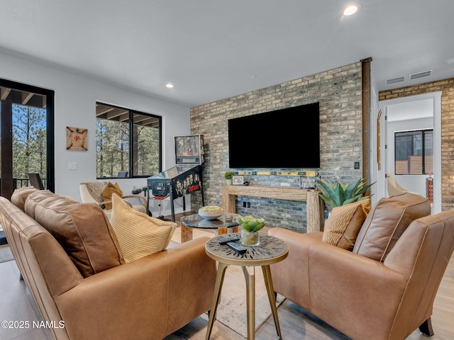 2566 S Cottonrose Ln, Flagstaff, AZ 86005 - living room with wood finished floors, a fireplace, and recessed lighting