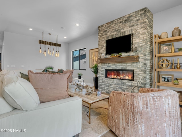 2566 S Cottonrose Ln, Flagstaff, AZ 86005 - living room with wood finished floors, a fireplace, and recessed lighting