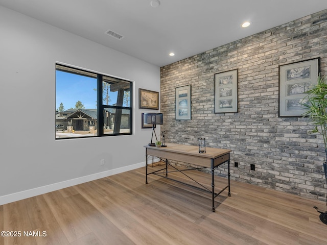 2566 S Cottonrose Ln, Flagstaff, AZ 86005 - home office with brick wall, wood finished floors, baseboards, and recessed lighting