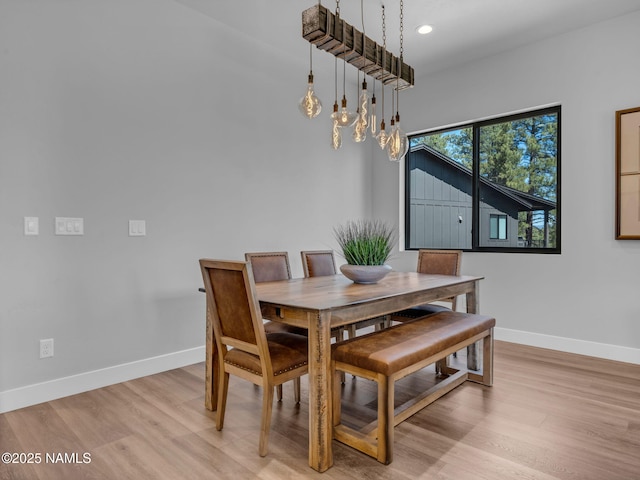 2566 S Cottonrose Ln, Flagstaff, AZ 86005 - dining space featuring baseboards, light wood-style floors, recessed lighting, and a chandelier