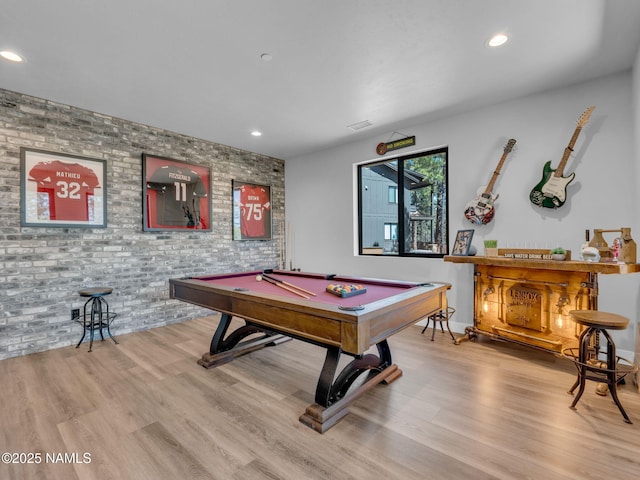 2566 S Cottonrose Ln, Flagstaff, AZ 86005 - game room with wood finished floors, billiards table, brick wall, recessed lighting, and a dry bar