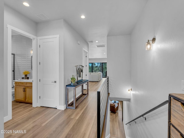 2566 S Cottonrose Ln, Flagstaff, AZ 86005 - hall with light wood finished floors, baseboards, and recessed lighting