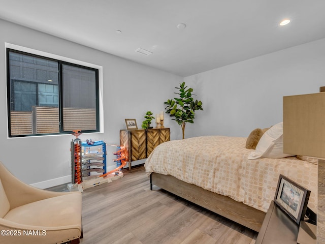 2566 S Cottonrose Ln, Flagstaff, AZ 86005 - bedroom featuring wood finished floors, recessed lighting, and baseboards