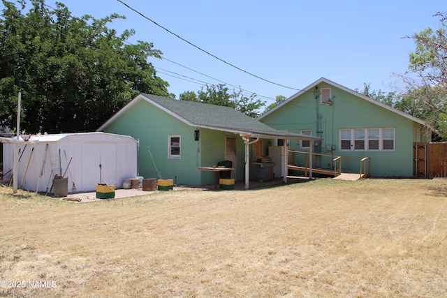 620 W Elm St, Winslow, AZ 86047 - back of property featuring a shed and roof with shingles