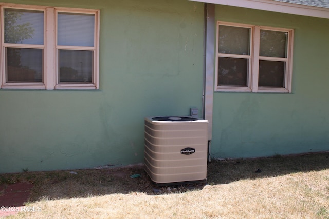 620 W Elm St, Winslow, AZ 86047 - exterior view of a central AC unit and stucco siding