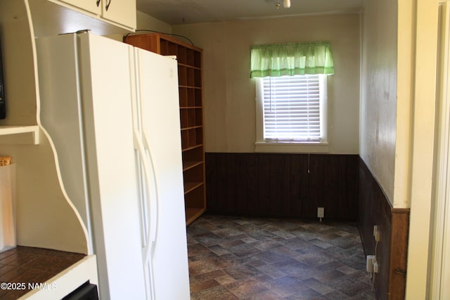 620 W Elm St, Winslow, AZ 86047 - kitchen with freestanding refrigerator and a wainscoted wall