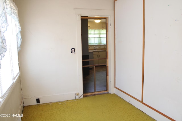 620 W Elm St, Winslow, AZ 86047 - unfurnished room featuring light colored carpet and a sink